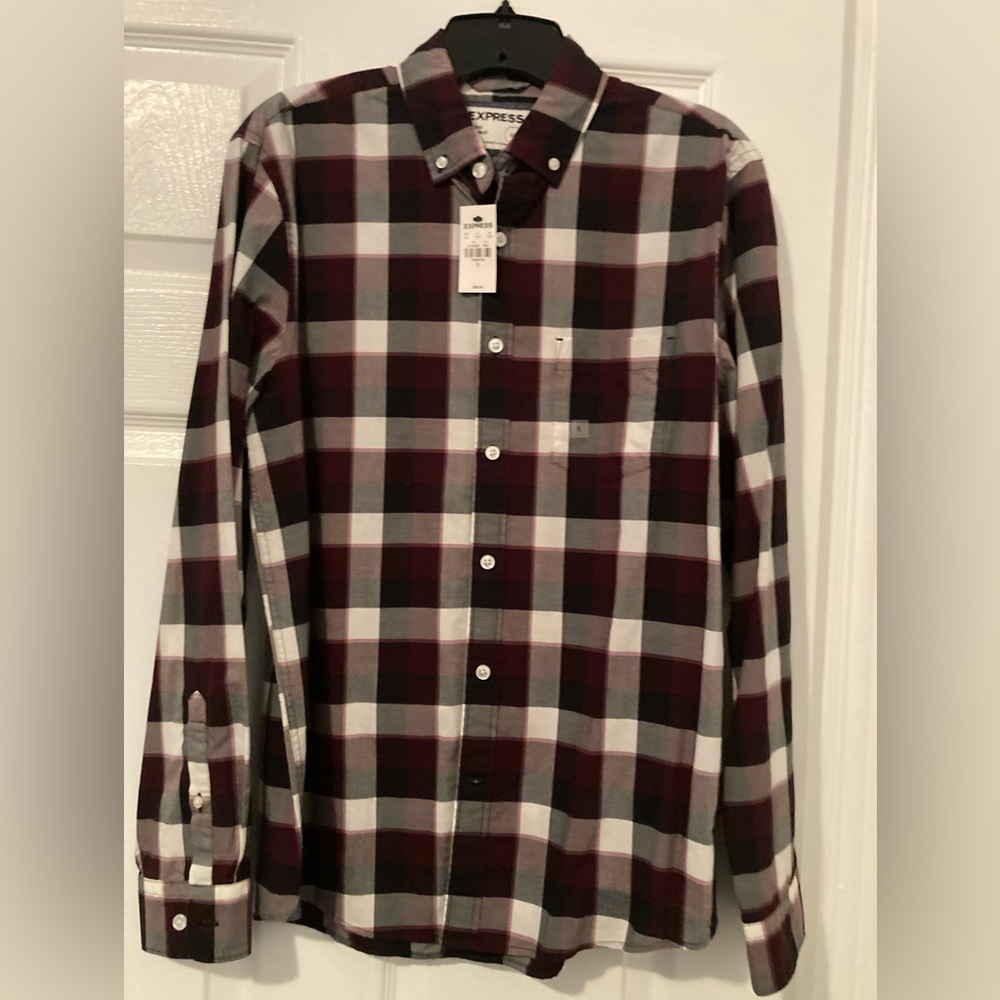NWT. Express Classic Button up. Can dressed when tucked in and casual untucked.